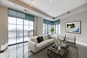 Living room with 10-foot ceilings with city views at park place at petworth station in washington, dc 20011